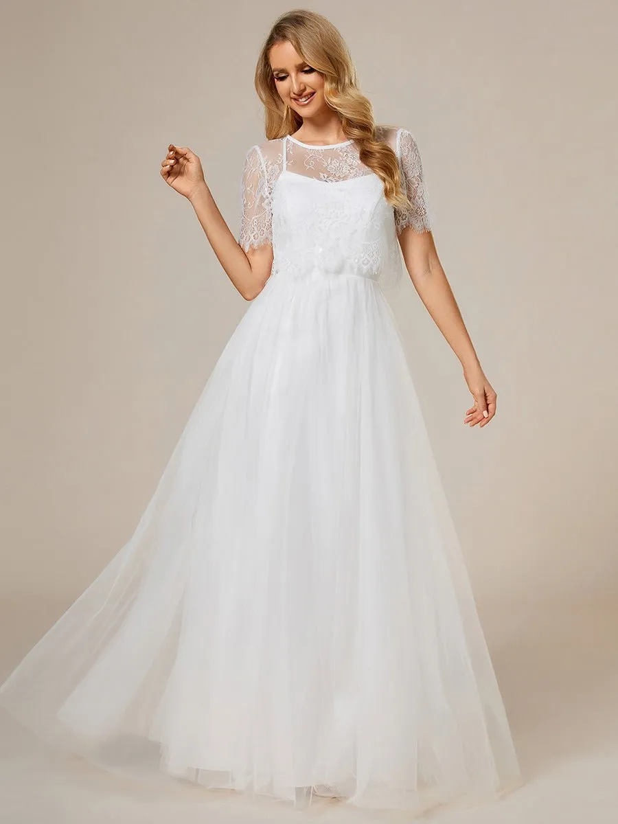 Whisper ivory soft knit and tulle cross back wedding dress and top