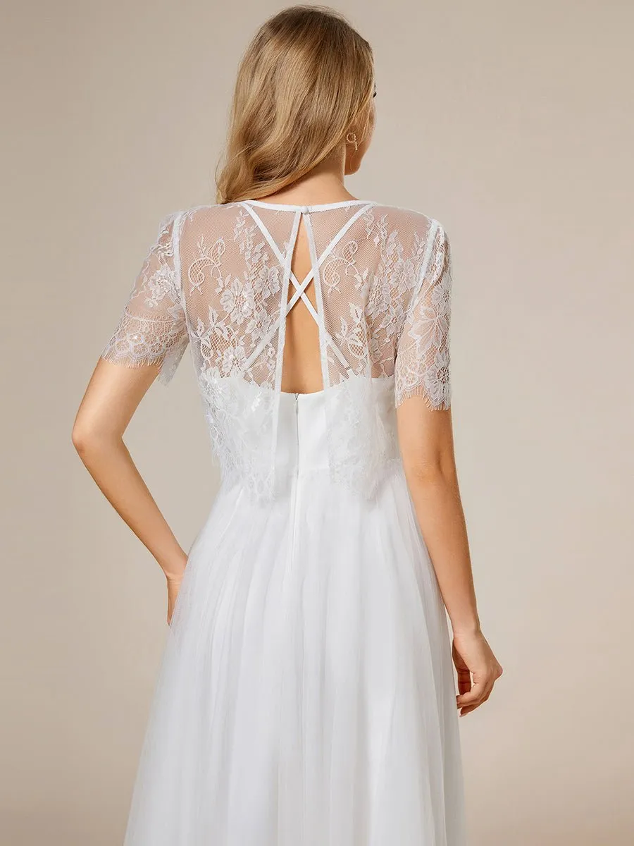 Whisper ivory soft knit and tulle cross back wedding dress and top